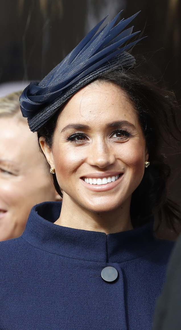 Meghan, Duchess of Sussex, waits for the bridal procession after the wedding of Princess Eugenie of York and Mr. Jack Brooksbank at St. George’s Chapel on Oct. 12, 2018 in Windsor, England.